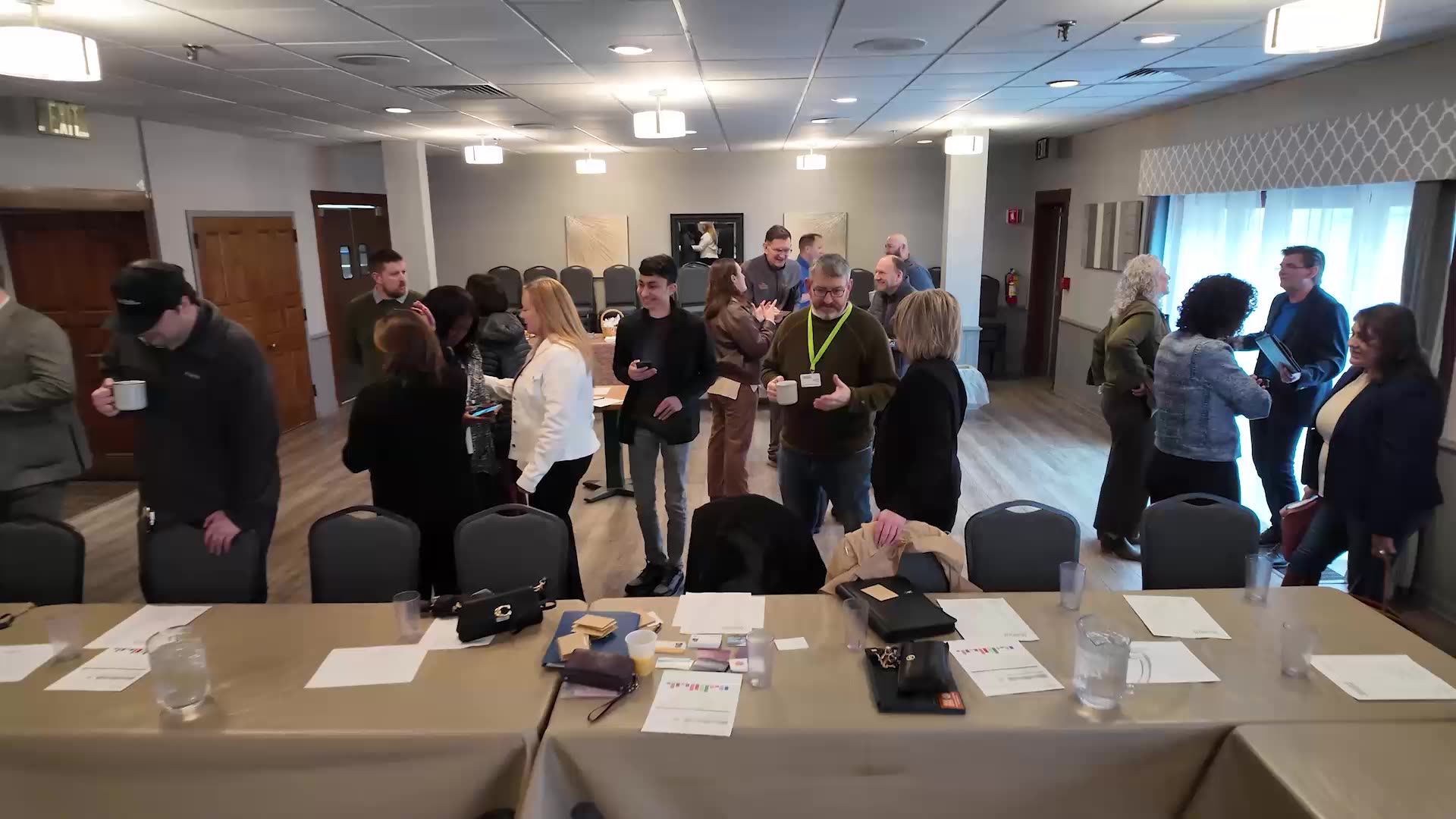 Members networking before a weekly meeting